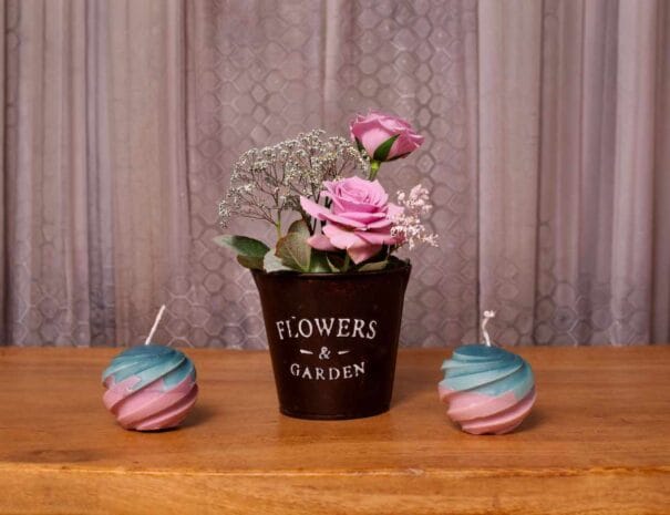 Photo of candles and flower pot at Soulara Hotel